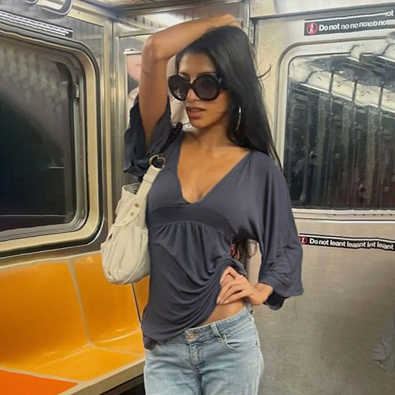 Deep V-neck high-waisted flared three-quarter sleeve top