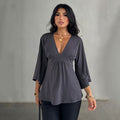 Deep V-neck high-waisted flared three-quarter sleeve top