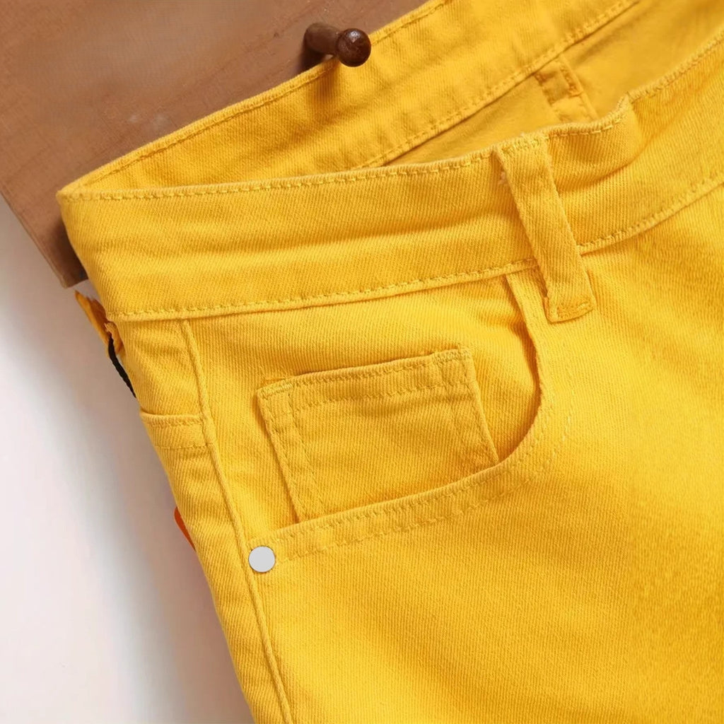 Men's ripped yellow stretch mid-length straight leg distressed denim shorts