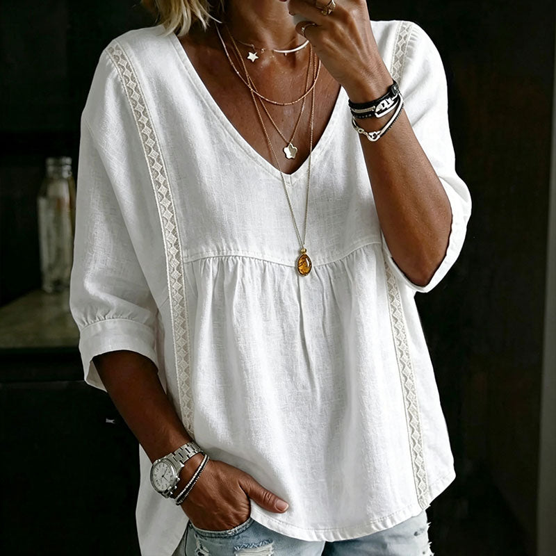 Casual, loose-fitting V-neck top with three-quarter sleeves