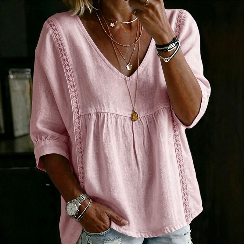 Casual, loose-fitting V-neck top with three-quarter sleeves